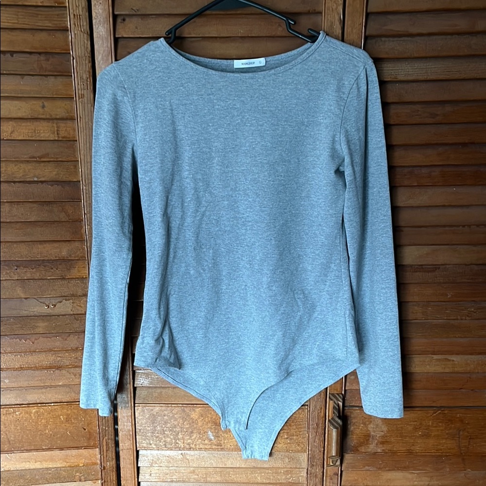 Gray long sleeve bodysuit with crew neck and asymmetrical style